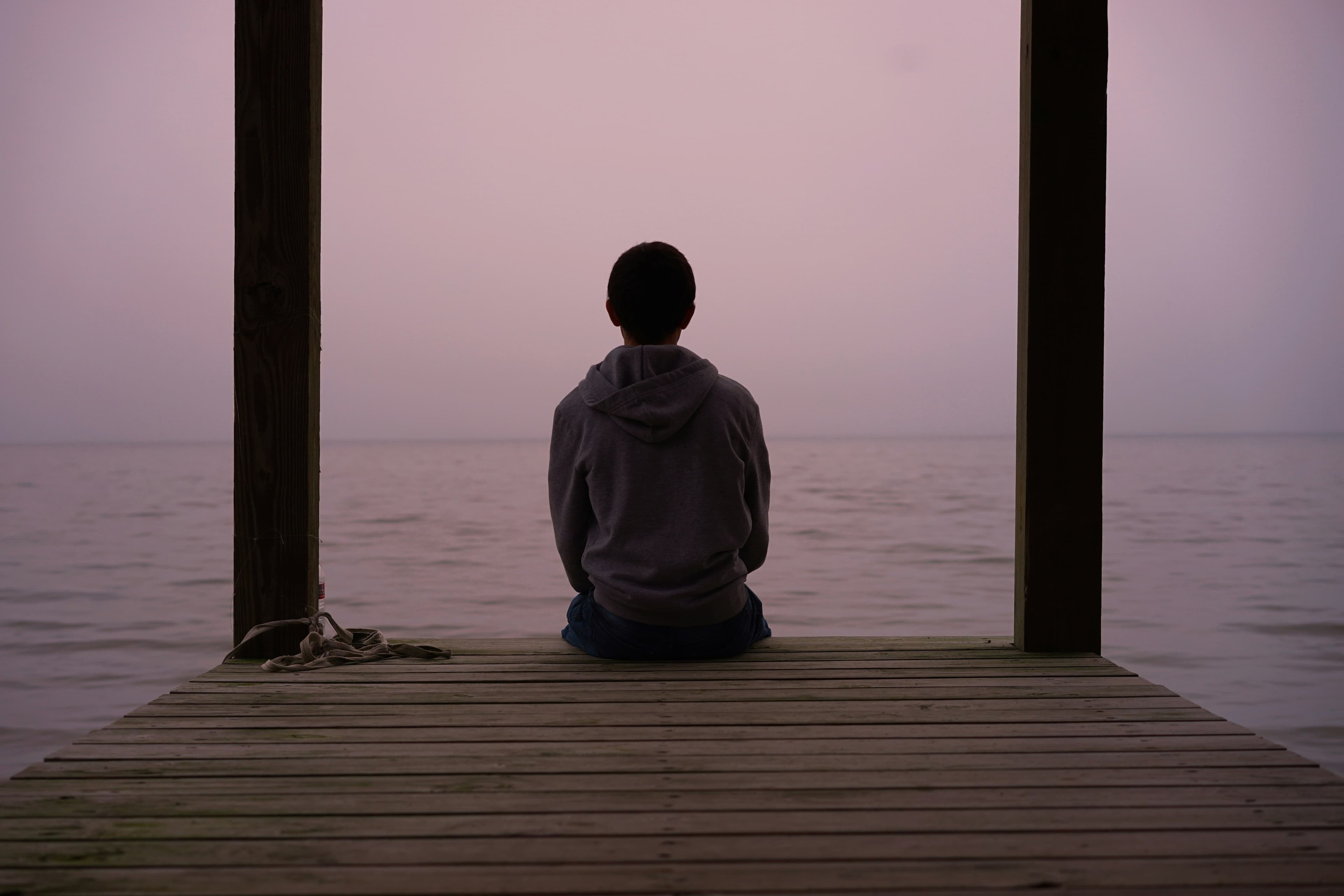 Woman sitting outdoors smiling